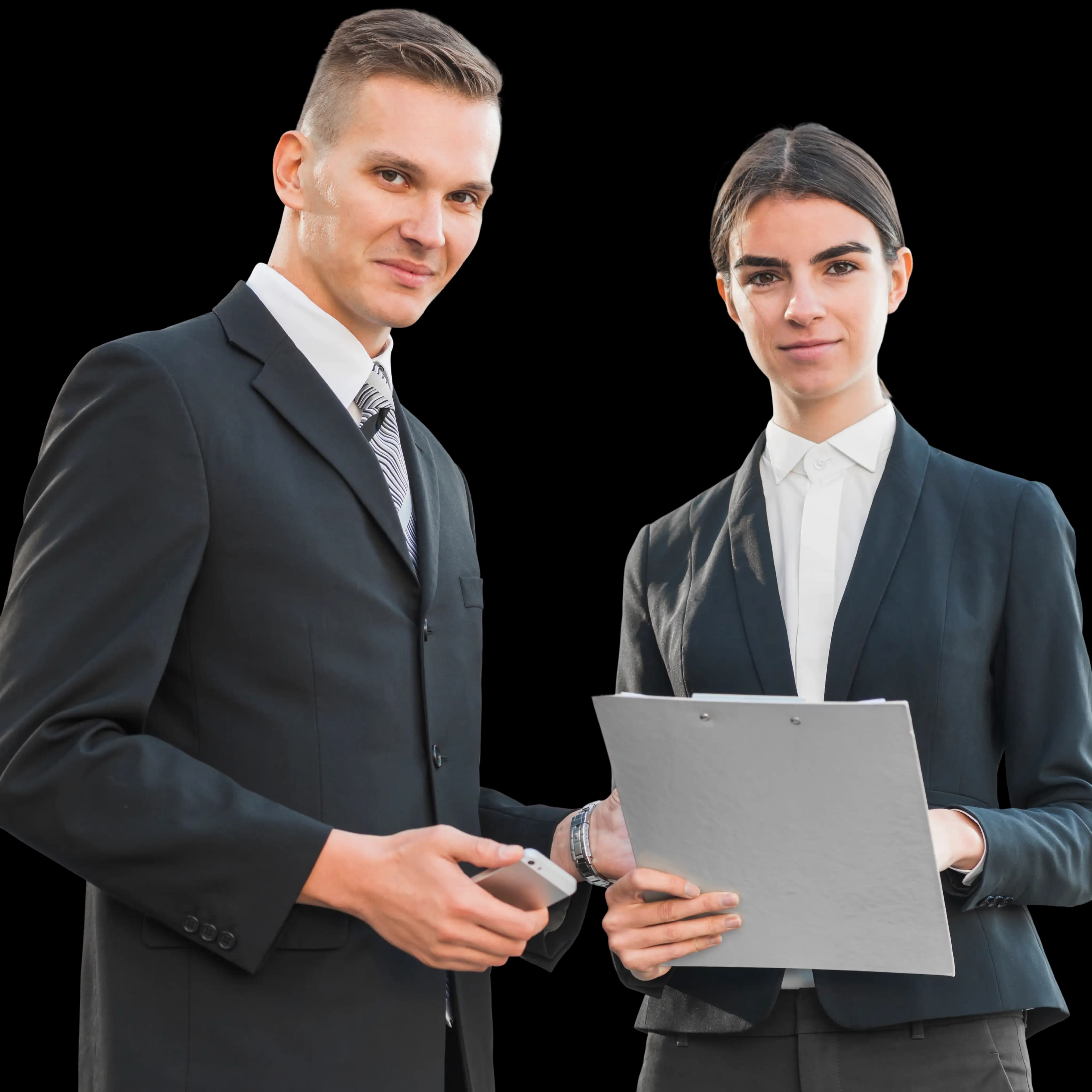 Two business professionals in formal attire smiling together, one holding a phone and the other holding a folder, representing secure and compliant BOI reporting.
