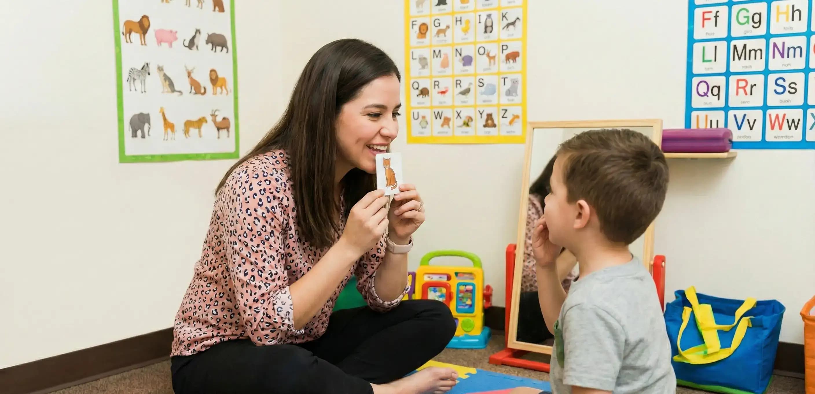 Private speech therapist working with a young student, illustrating a service professional who can save on taxes by comparing LLC vs S Corporation status.