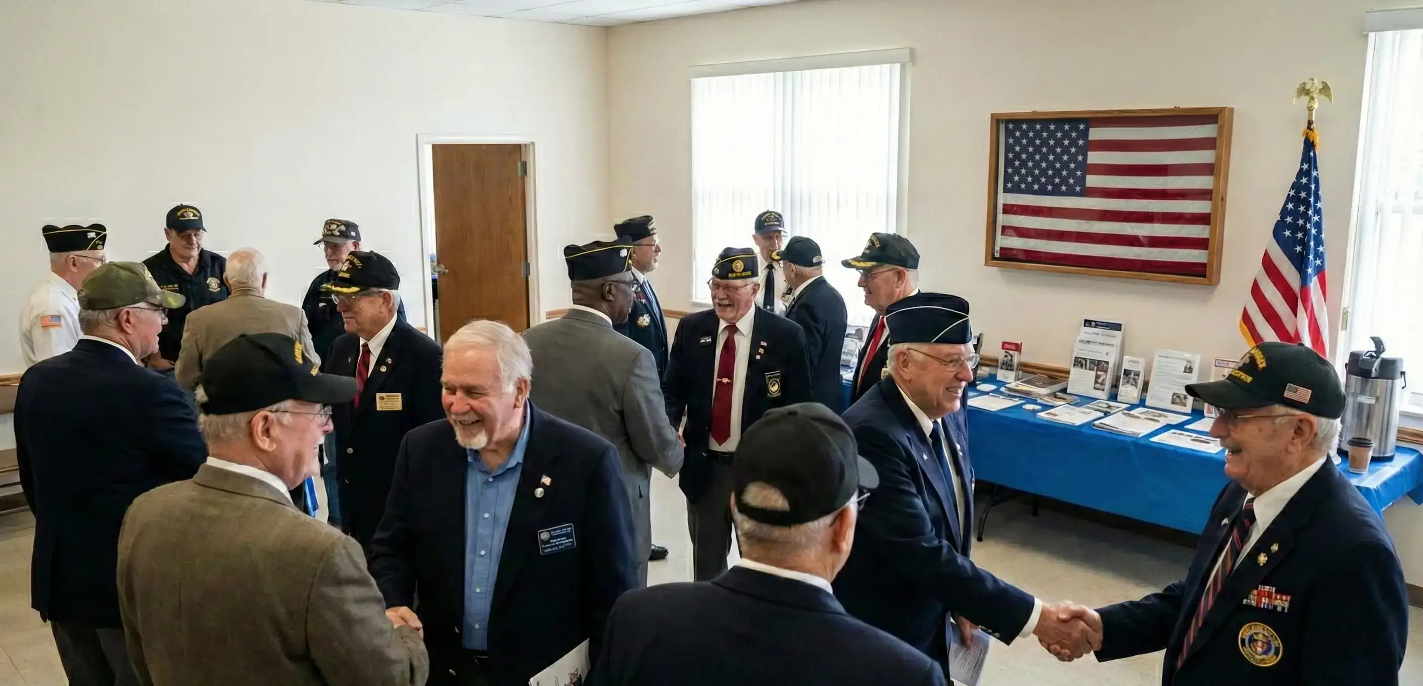 American veterans foundation members shaking hands at a meeting, illustrating a dedicated community group that successfully managed to start a nonprofit organization in Florida.